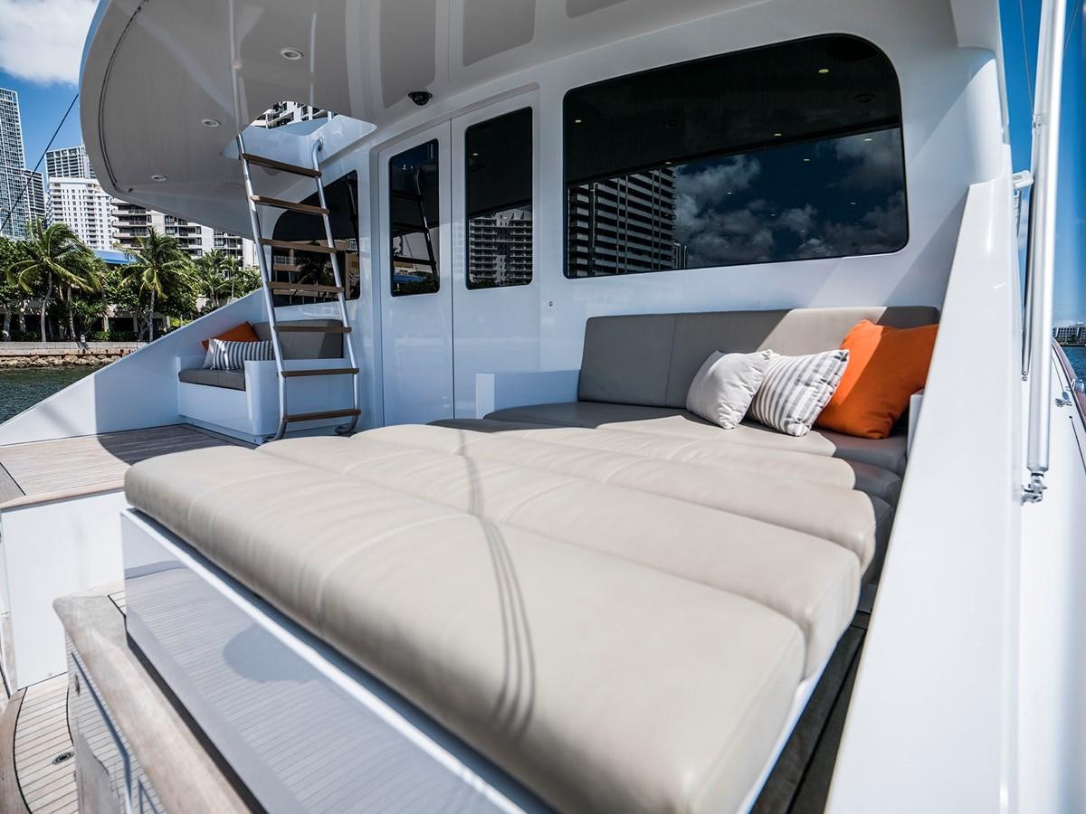 a white bed in a room aboard SATU Yacht for Sale