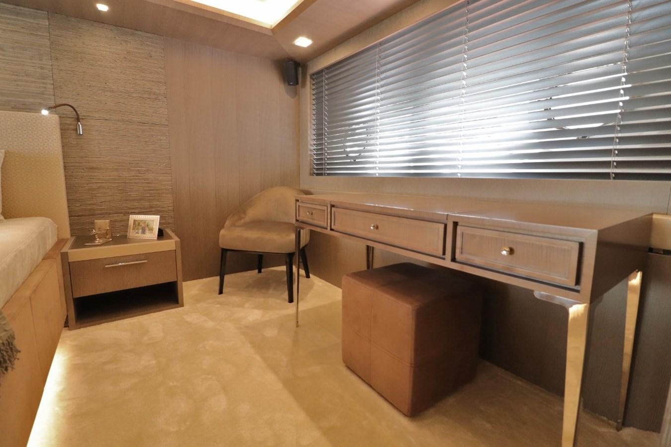 a room with a desk and a chair aboard MONTE CARLO YACHTS 86 Yacht for Sale