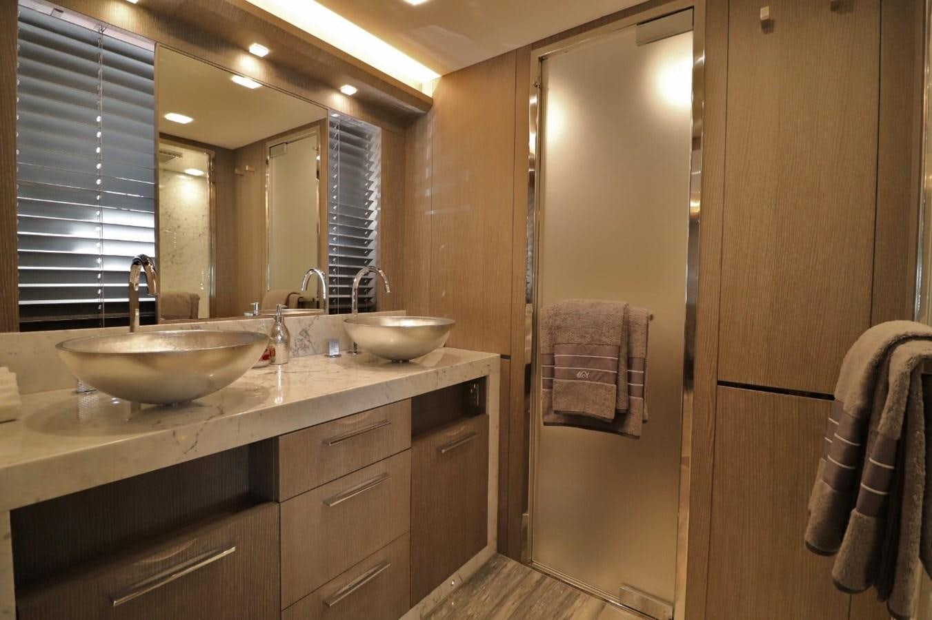 a bathroom with a sink and a shower aboard MONTE CARLO YACHTS 86 Yacht for Sale