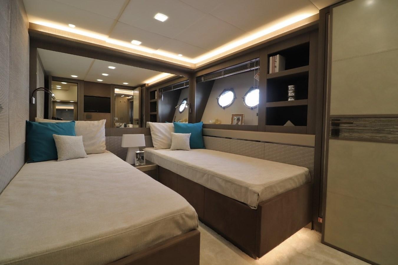 a room with two beds aboard MONTE CARLO YACHTS 86 Yacht for Sale