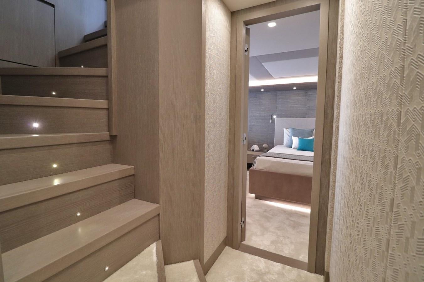 a room with a bed and a mirror aboard MONTE CARLO YACHTS 86 Yacht for Sale