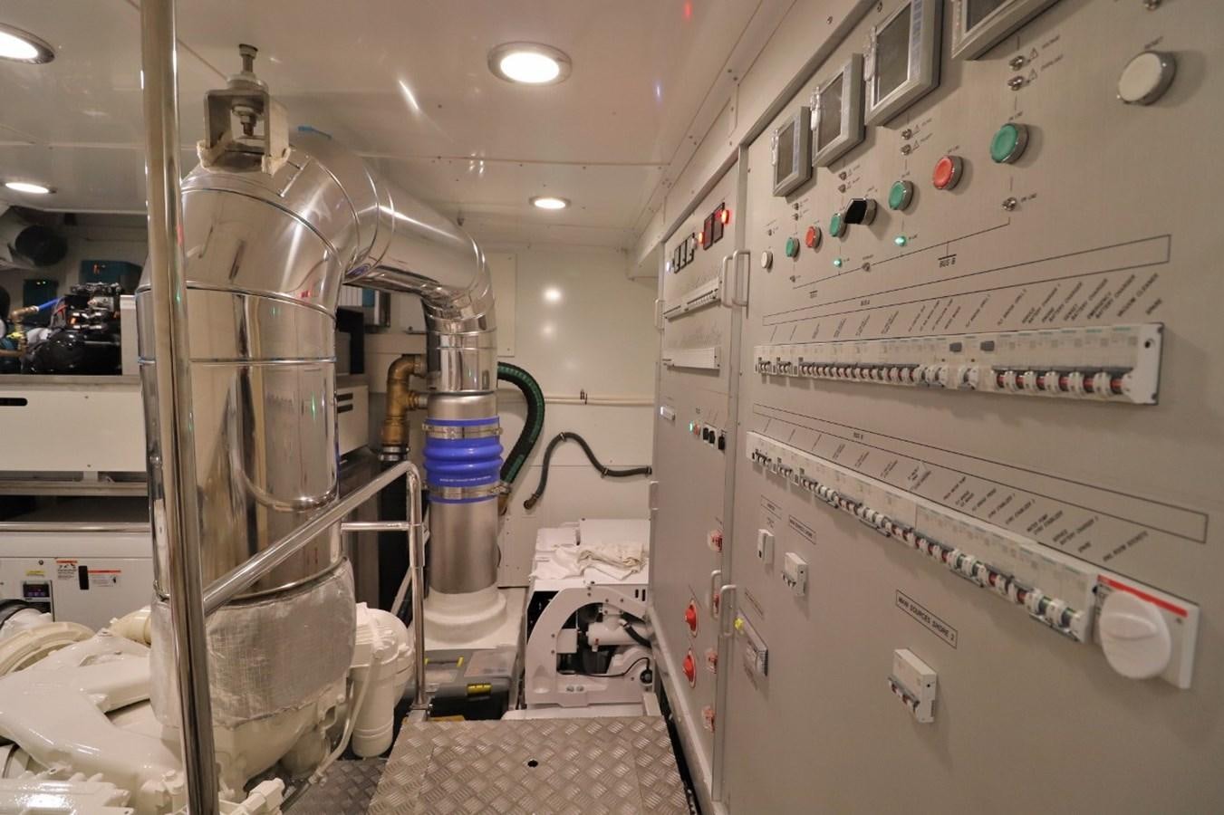 a room with white machines aboard MONTE CARLO YACHTS 86 Yacht for Sale