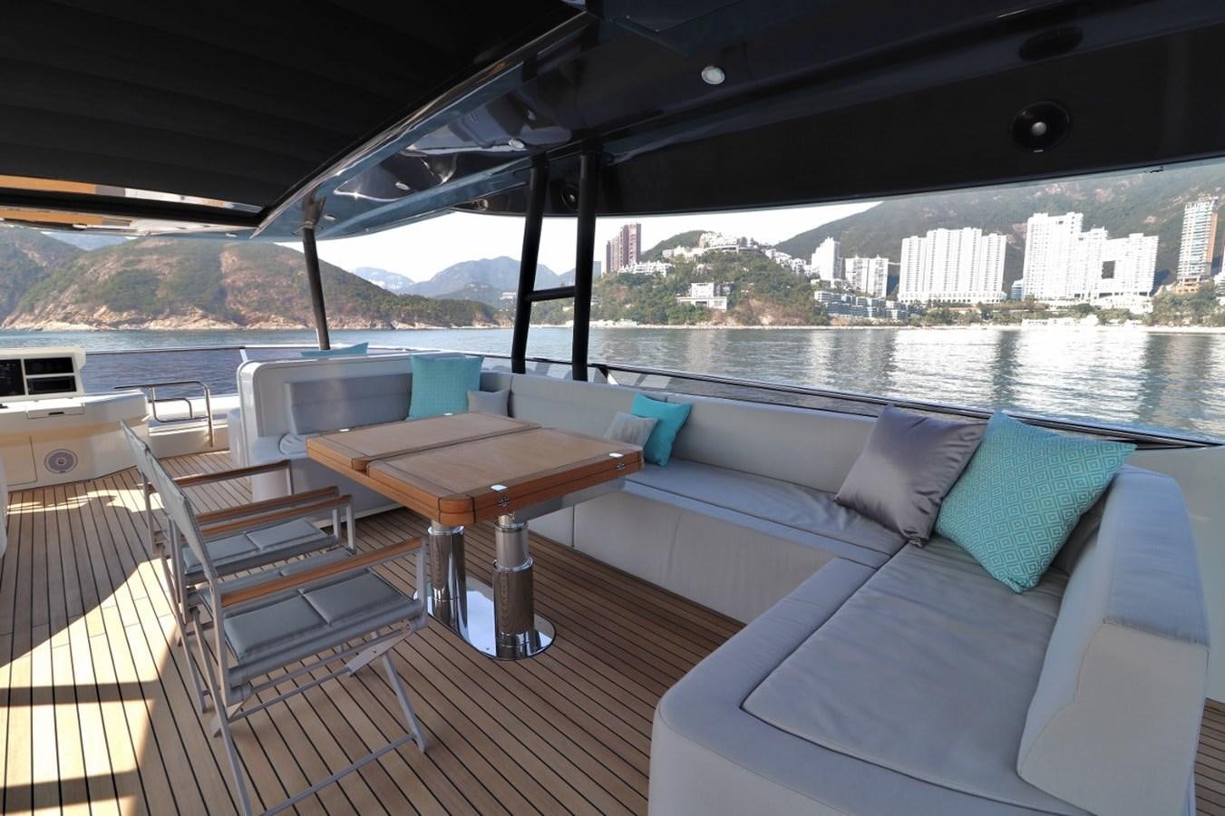 a deck with a view of a city and a body of water aboard MONTE CARLO YACHTS 86 Yacht for Sale