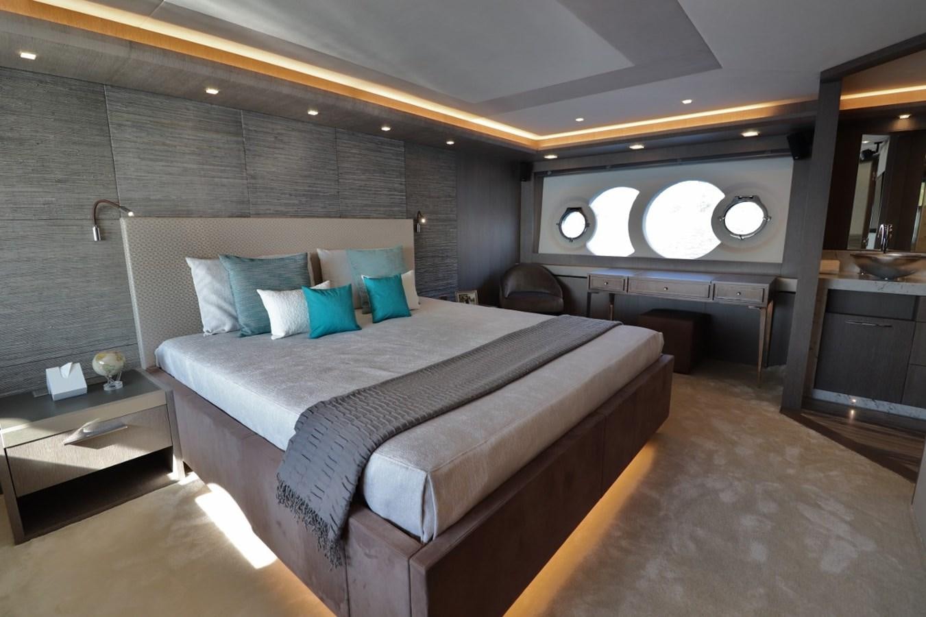 a large bed in a room aboard MONTE CARLO YACHTS 86 Yacht for Sale