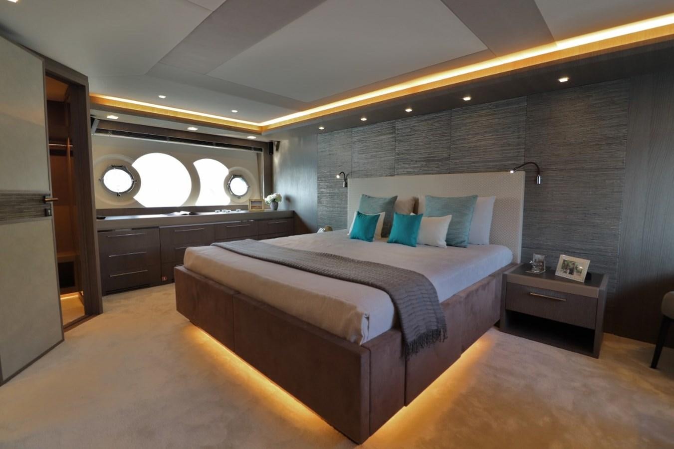 a bedroom with a bed aboard MONTE CARLO YACHTS 86 Yacht for Sale