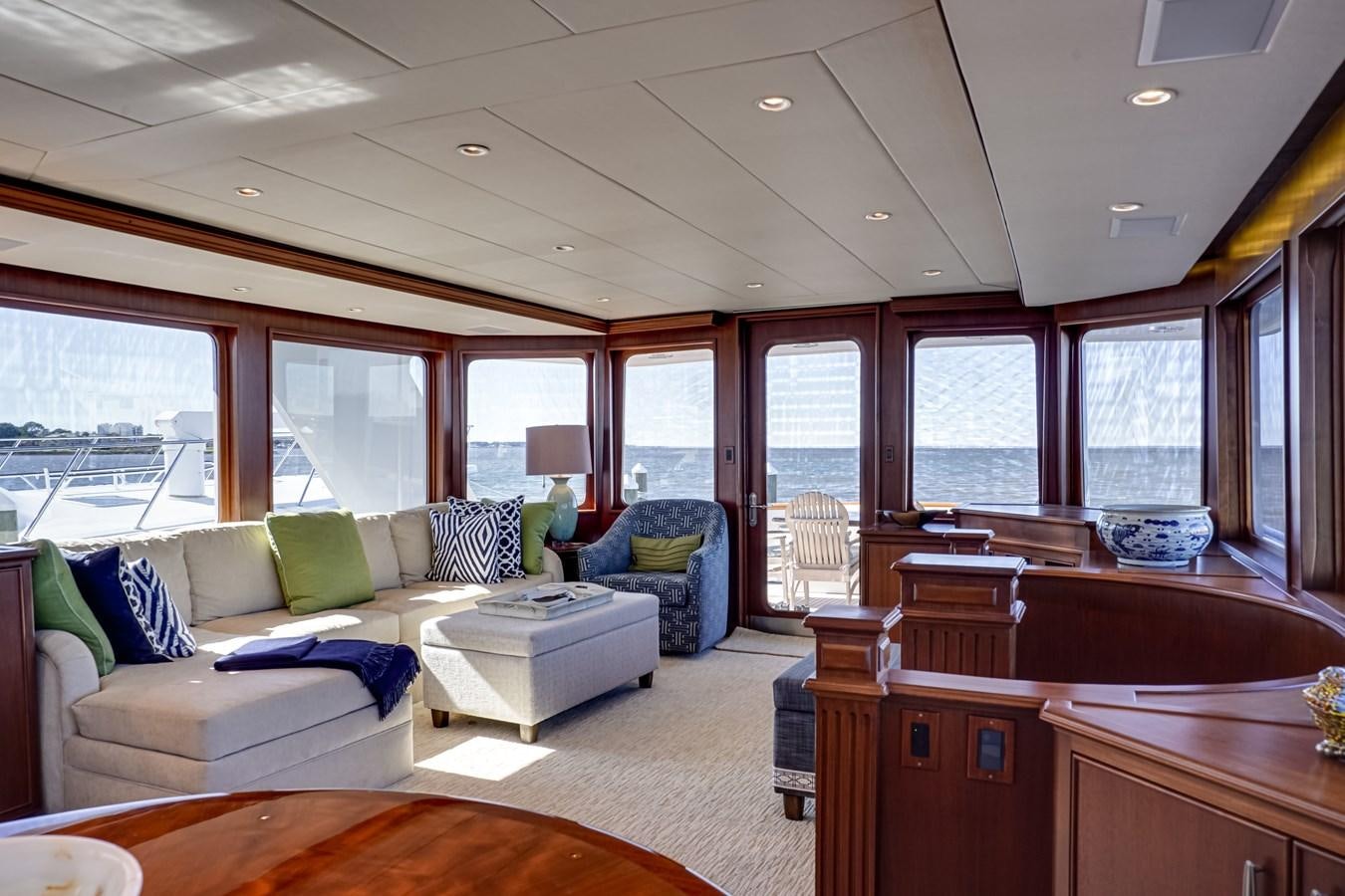 a living room with a couch and a table aboard CHECKERS Yacht for Sale