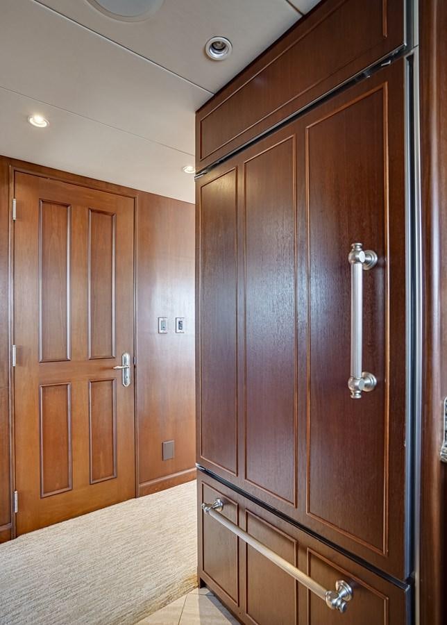 a wooden cabinet in a room aboard CHECKERS Yacht for Sale
