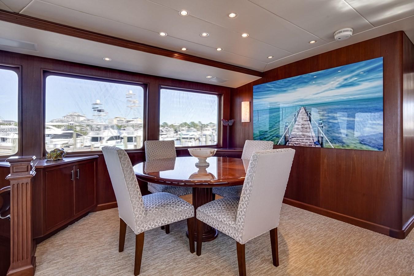 a room with a table and chairs aboard CHECKERS Yacht for Sale