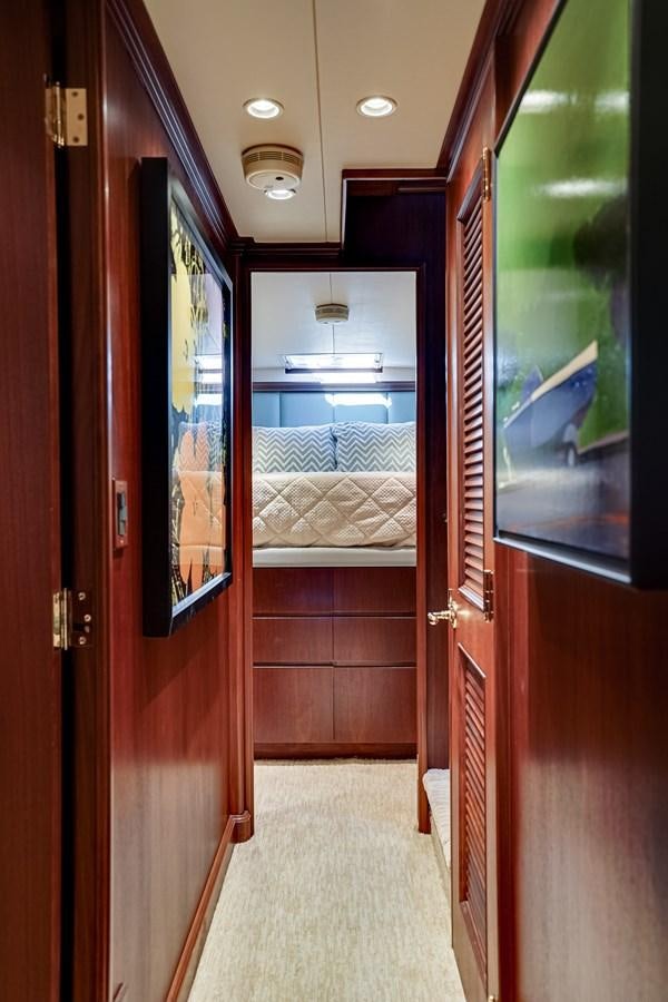 a room with a bed and a door aboard CHECKERS Yacht for Sale