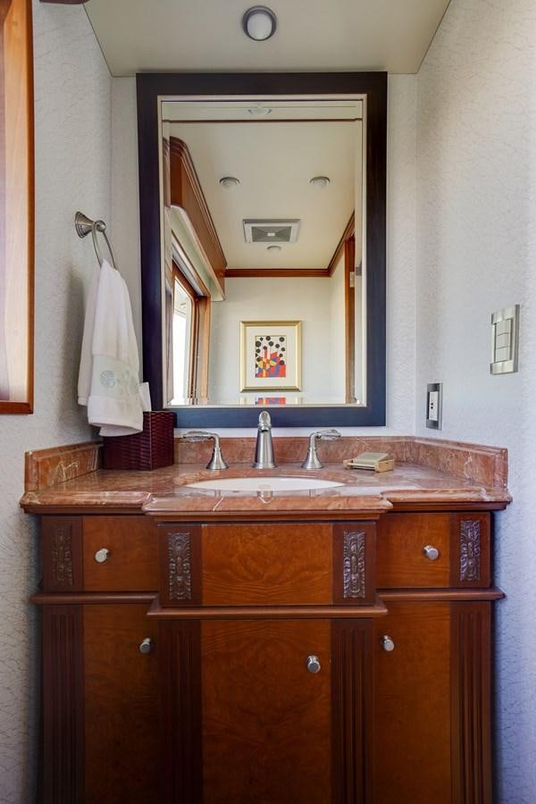 a bathroom with a mirror aboard CHECKERS Yacht for Sale