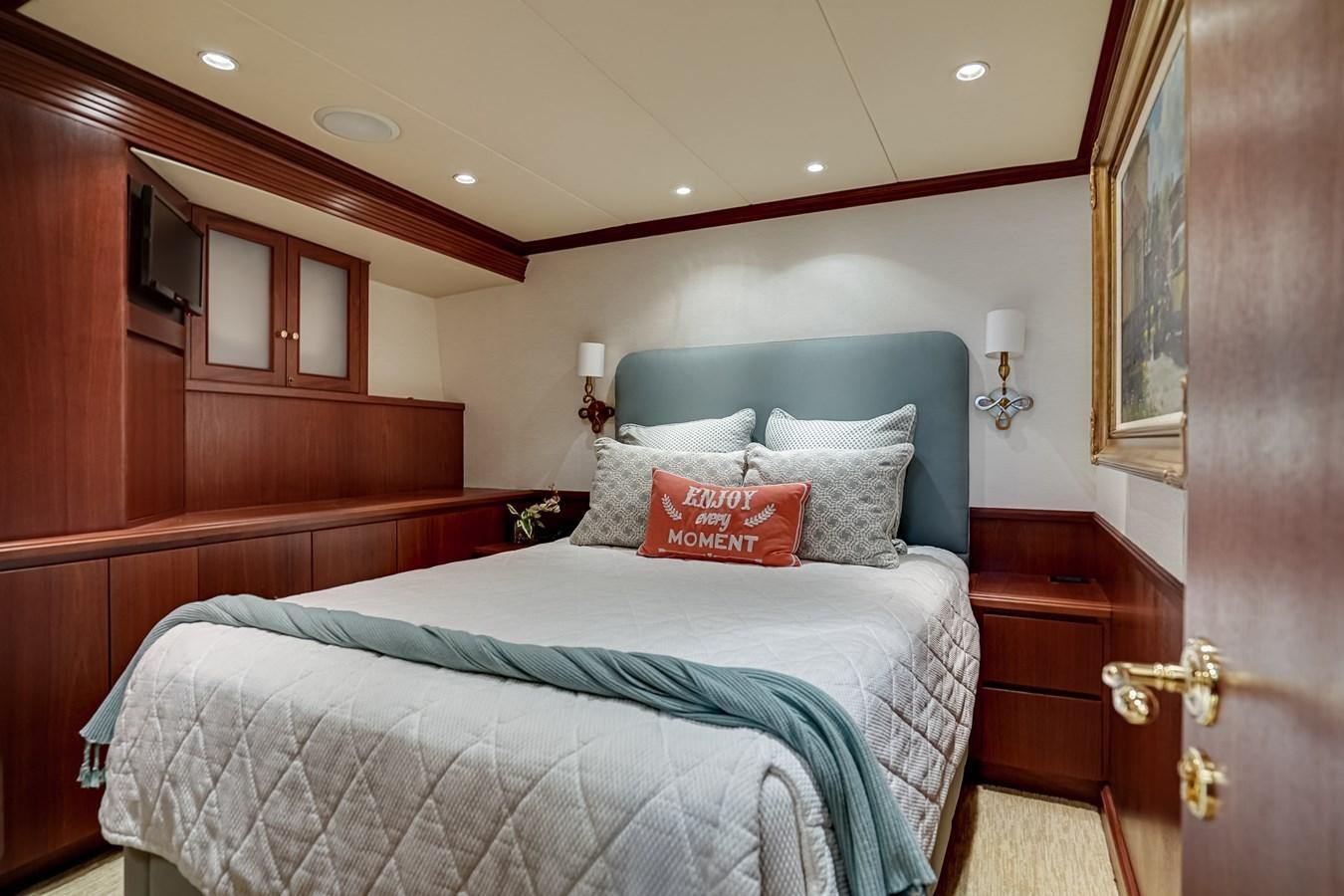 a bed with a pillow and pillows aboard CHECKERS Yacht for Sale