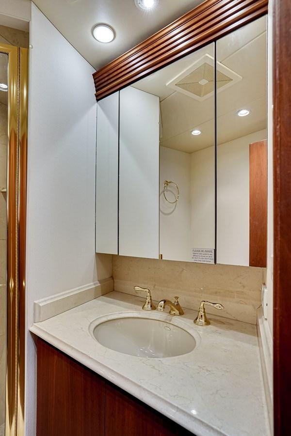 a bathroom with a large mirror aboard CHECKERS Yacht for Sale