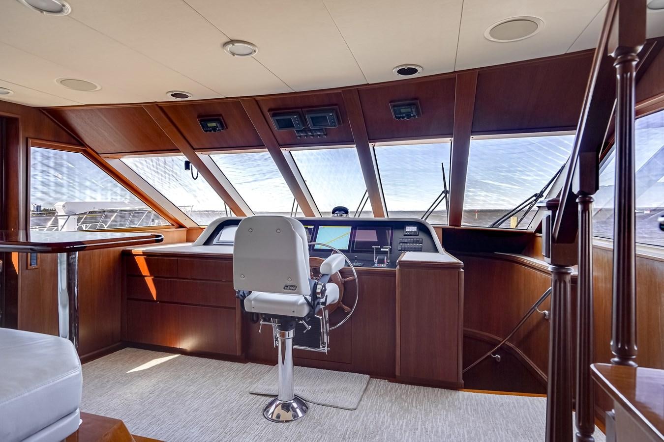 a bus with a chair and a desk aboard CHECKERS Yacht for Sale
