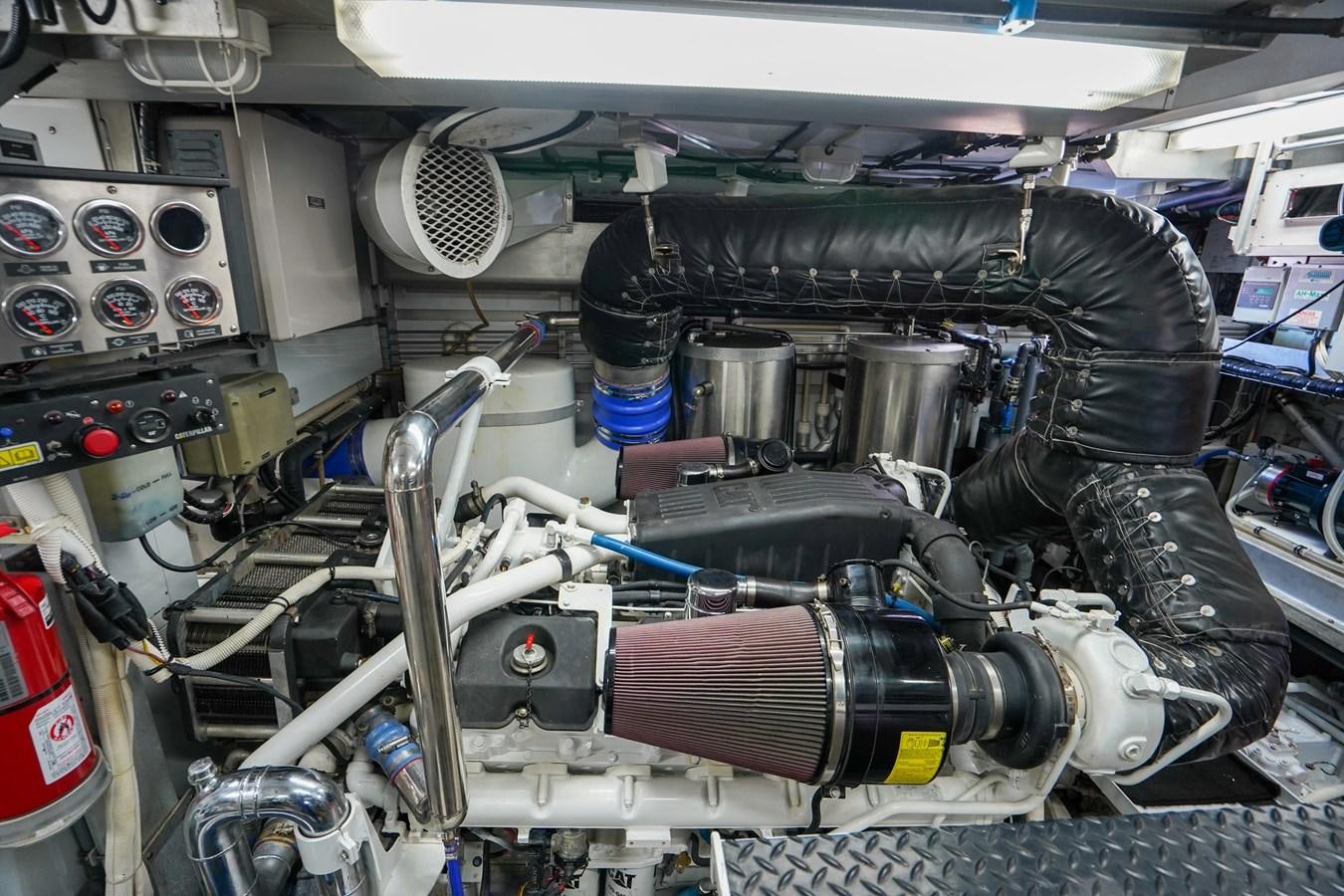 a car engine with a red and blue engine aboard CHECKERS Yacht for Sale