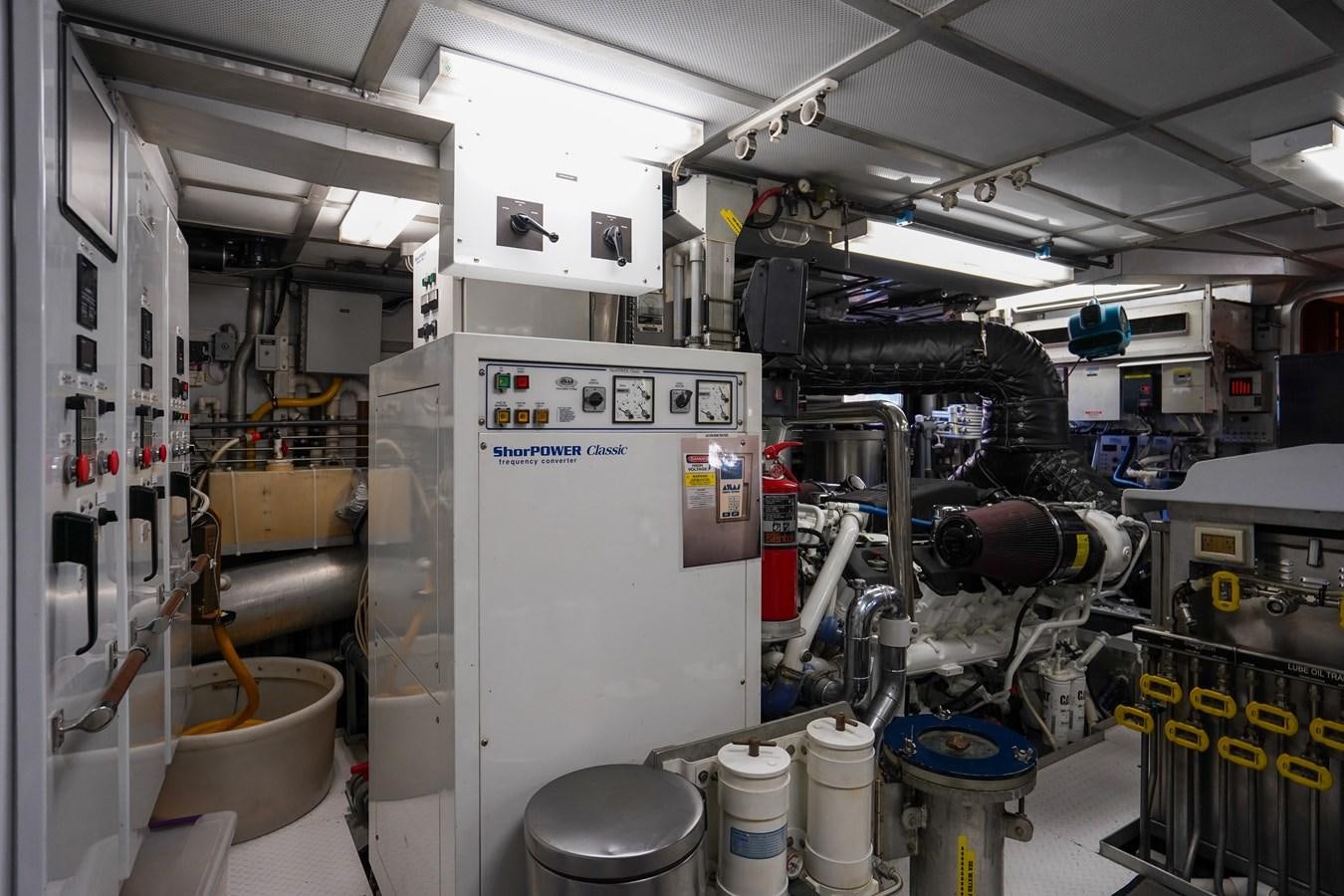 a room with machinery and pipes aboard CHECKERS Yacht for Sale