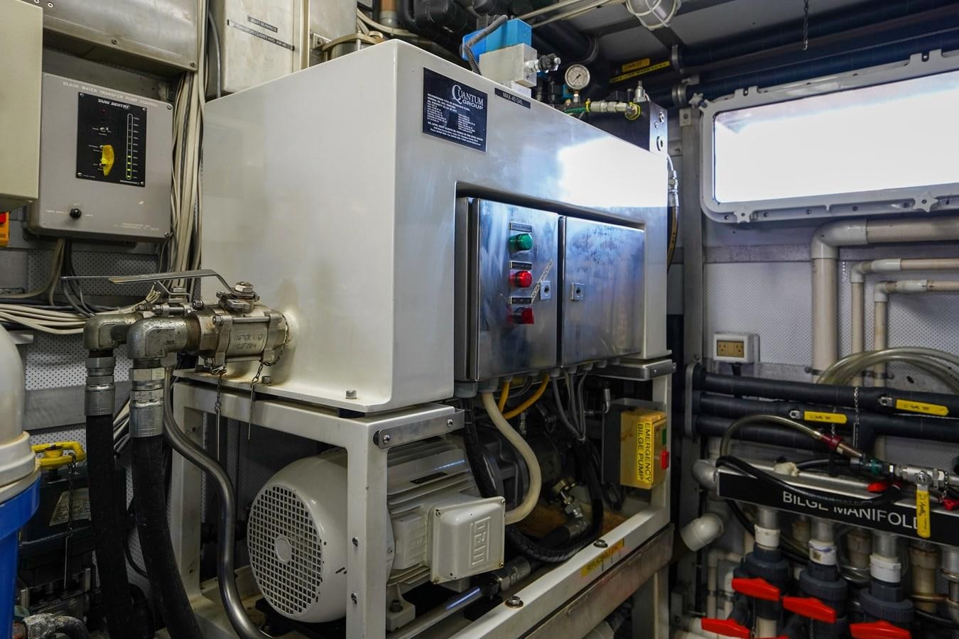 a machine with a large piece of equipment in it aboard CHECKERS Yacht for Sale