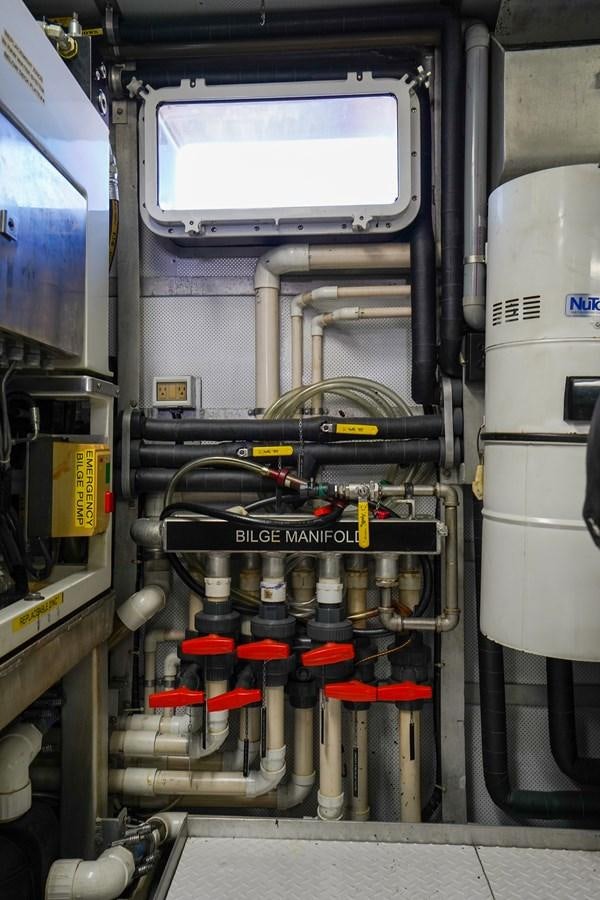 a machine with a large piece of equipment in it aboard CHECKERS Yacht for Sale