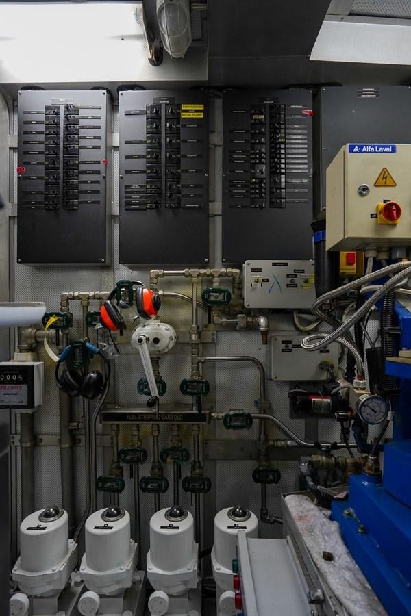 a room with pipes and equipment aboard CHECKERS Yacht for Sale