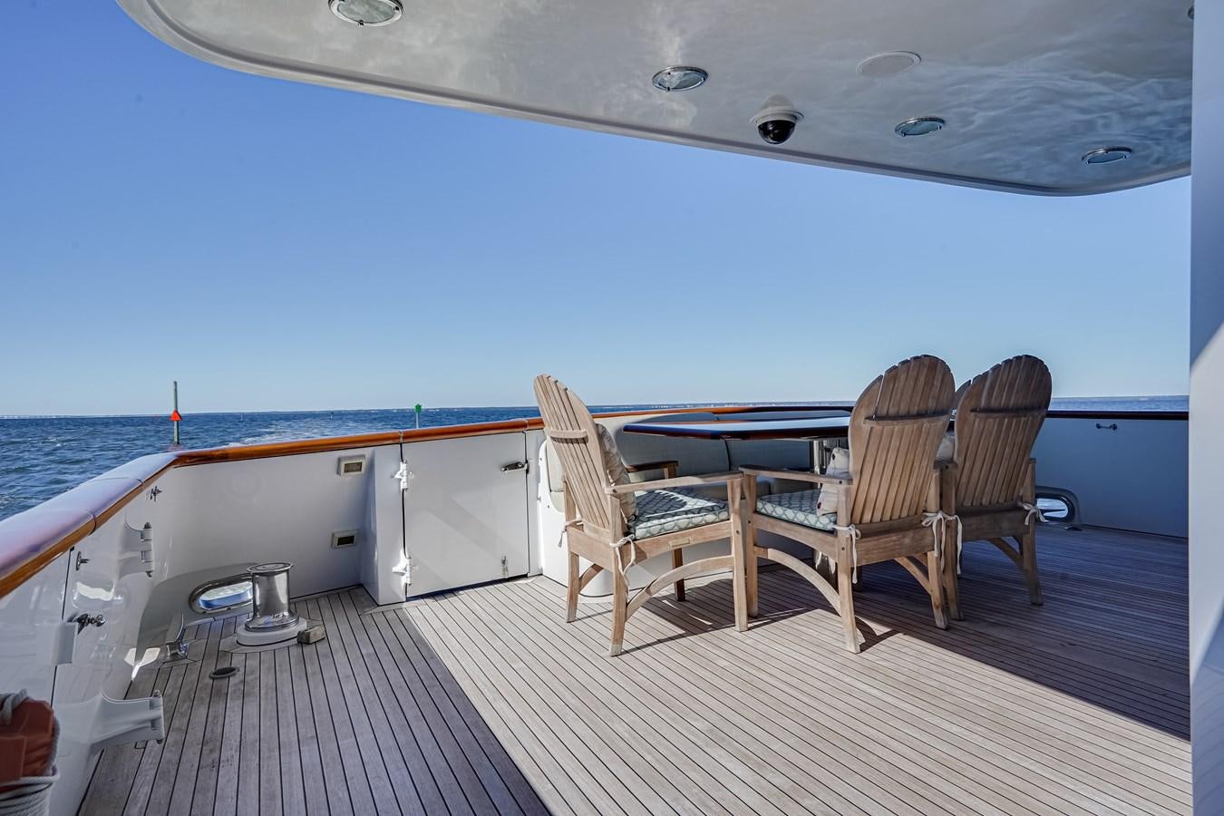 a deck with chairs on it aboard CHECKERS Yacht for Sale