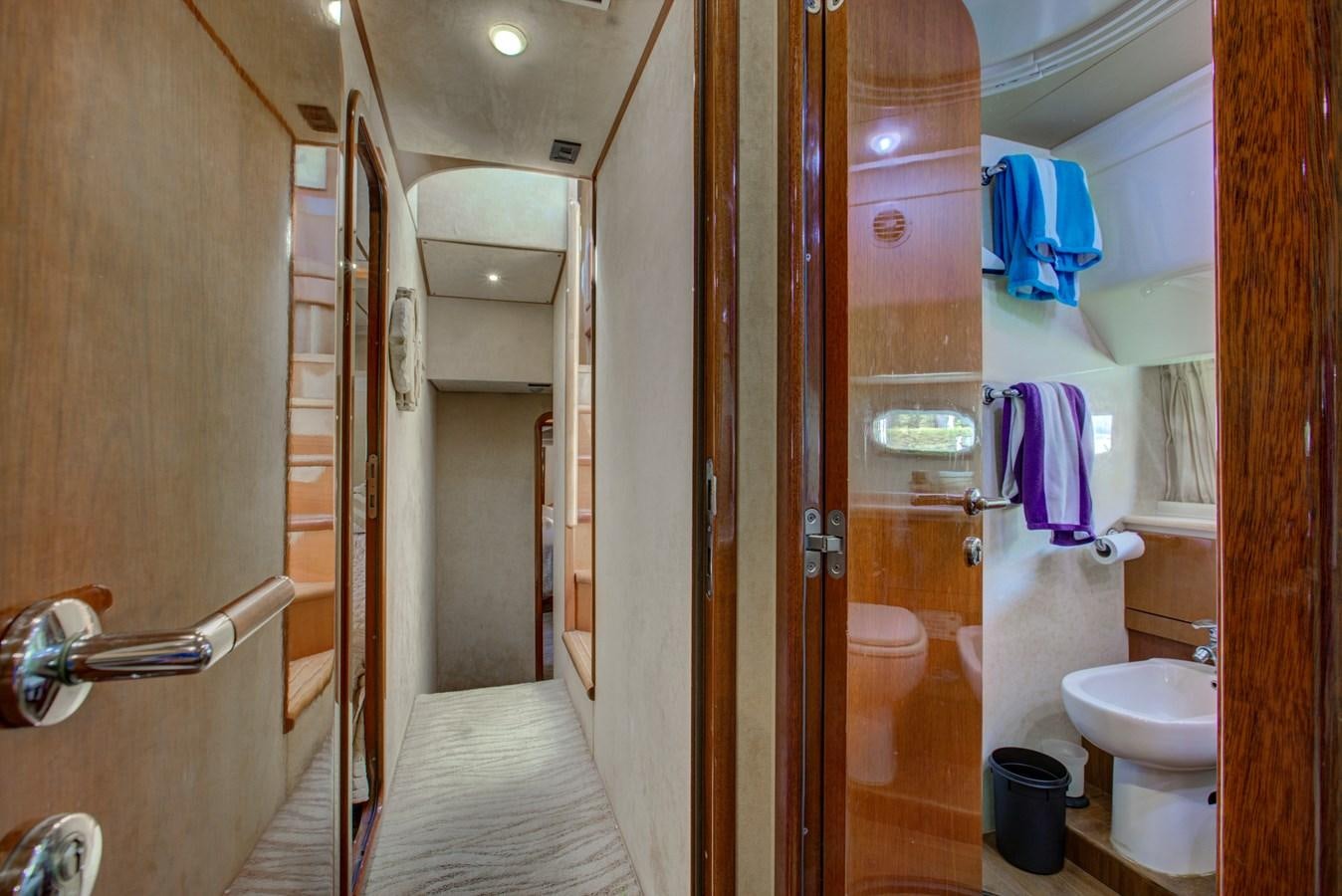 a bathroom with a toilet and a sink aboard FERRETTI Yacht for Sale