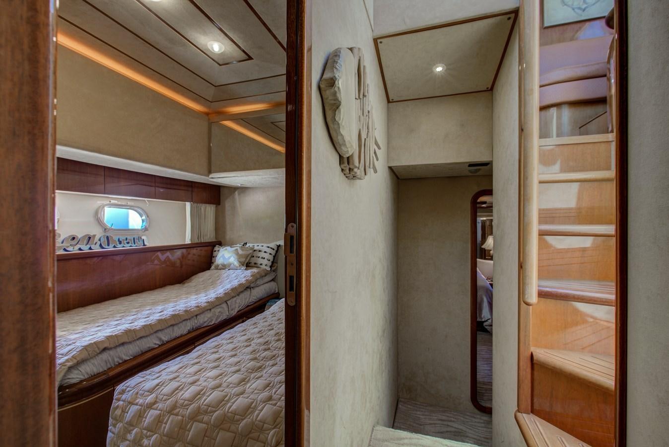 a room with two beds aboard FERRETTI Yacht for Sale