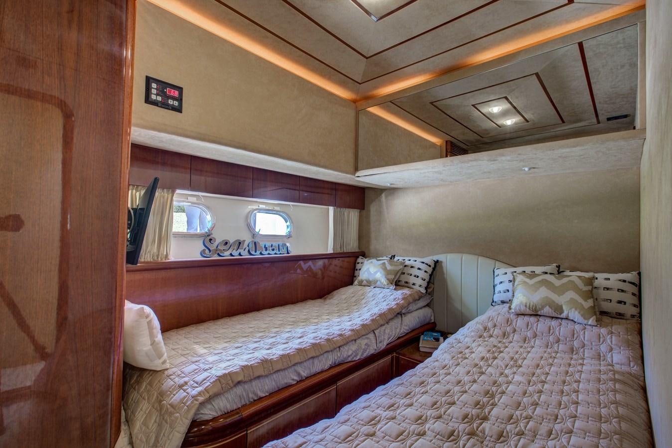 a couple of beds in a room aboard FERRETTI Yacht for Sale