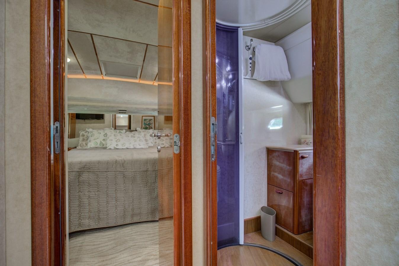 a bathroom with a bed and a mirror aboard FERRETTI Yacht for Sale