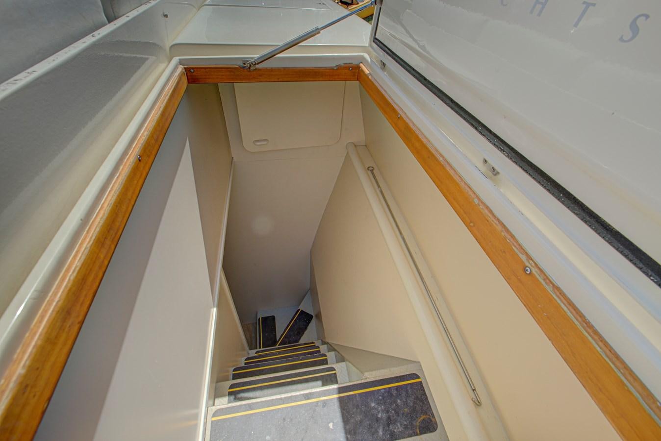a white and brown staircase aboard FERRETTI Yacht for Sale