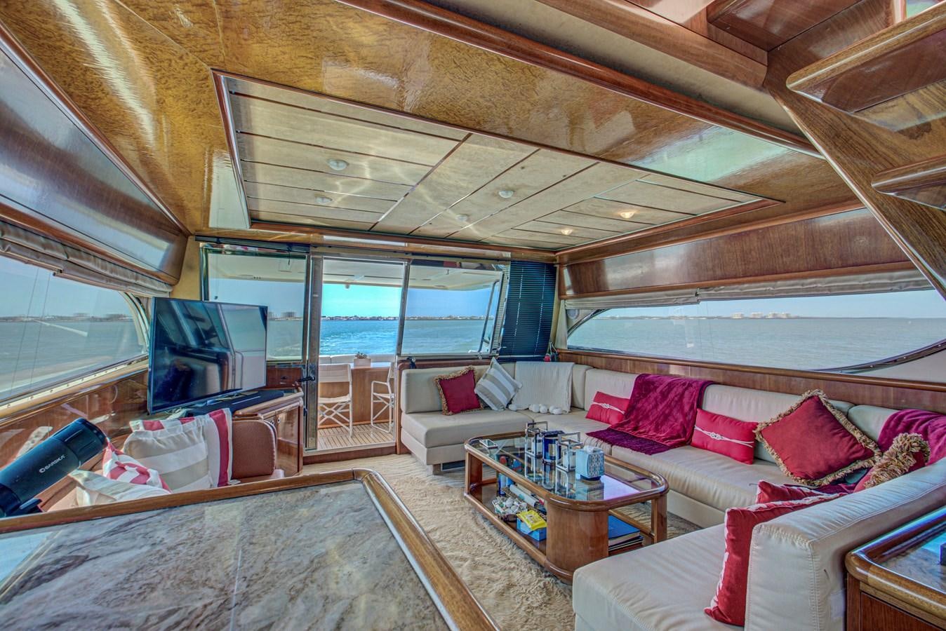a living room with a large window aboard FERRETTI Yacht for Sale