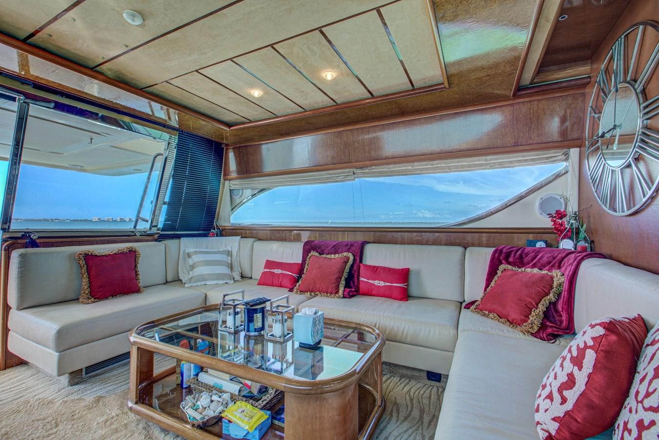 a living room with a couch and a table aboard FERRETTI Yacht for Sale