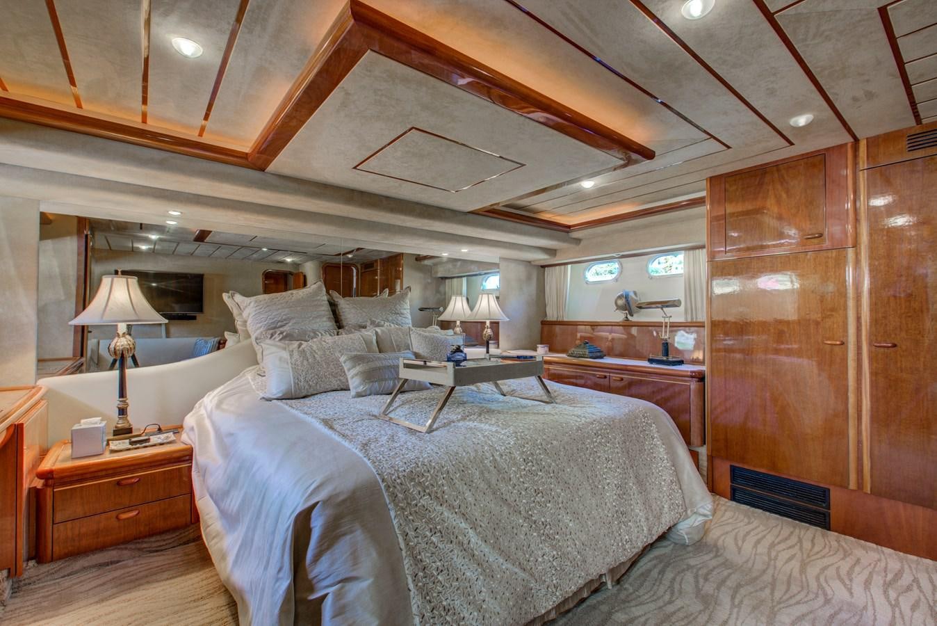 a room with a bed and a desk aboard FERRETTI Yacht for Sale