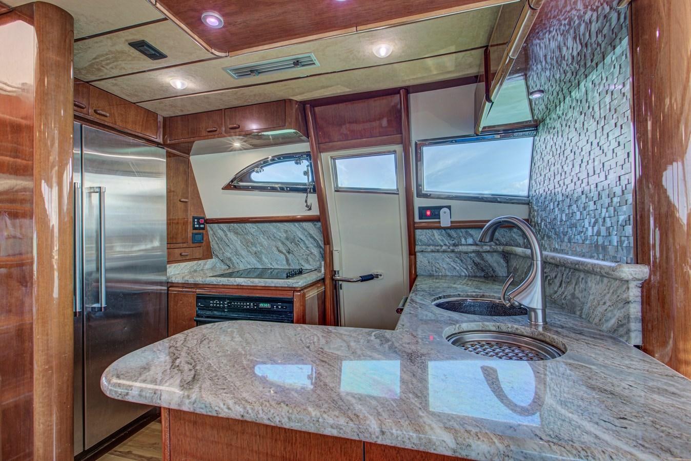 a room with a bed and a table aboard FERRETTI Yacht for Sale
