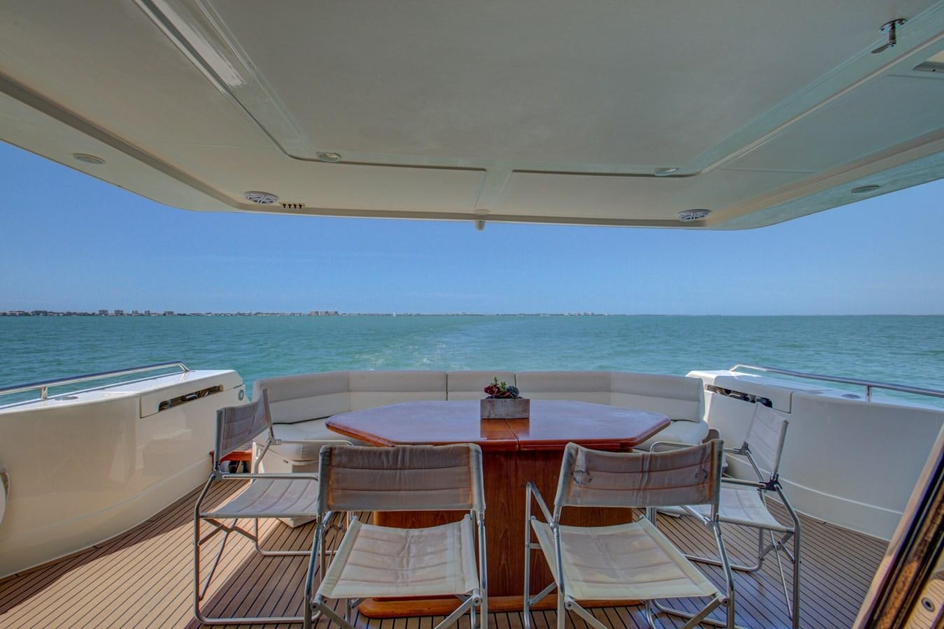 a table and chairs on a boat aboard FERRETTI Yacht for Sale