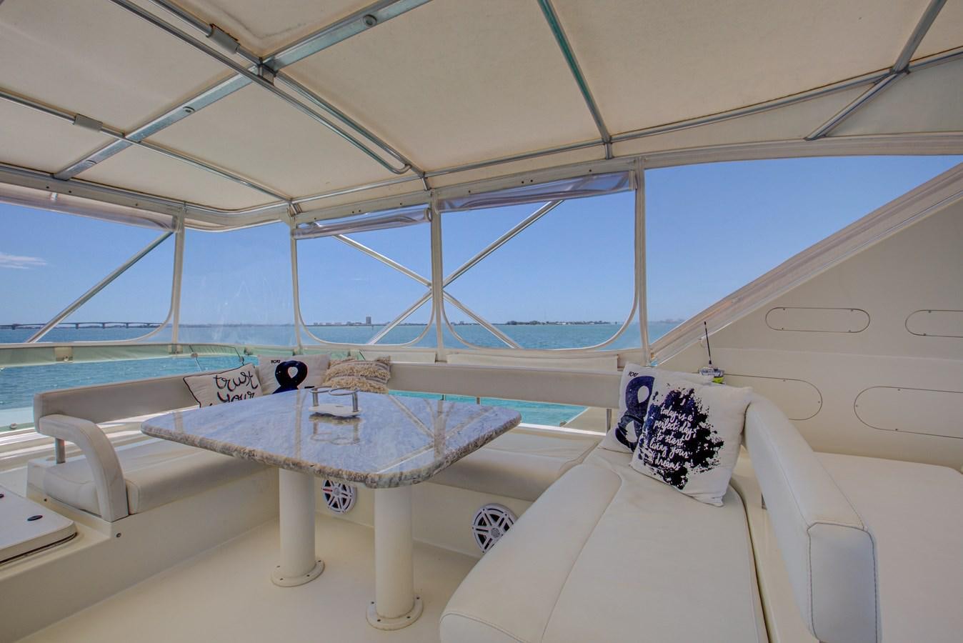 a boat with a table and chairs aboard FERRETTI Yacht for Sale