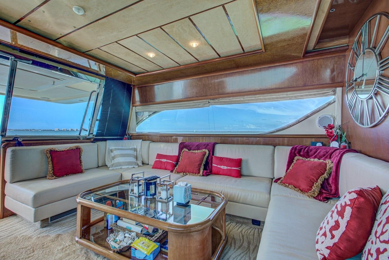 a living room with a couch and a table aboard FERRETTI Yacht for Sale