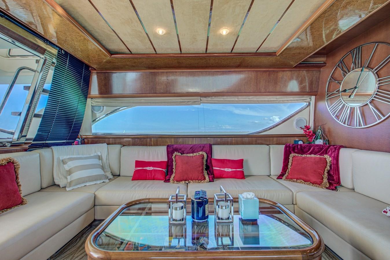 a living room with a large window aboard FERRETTI Yacht for Sale