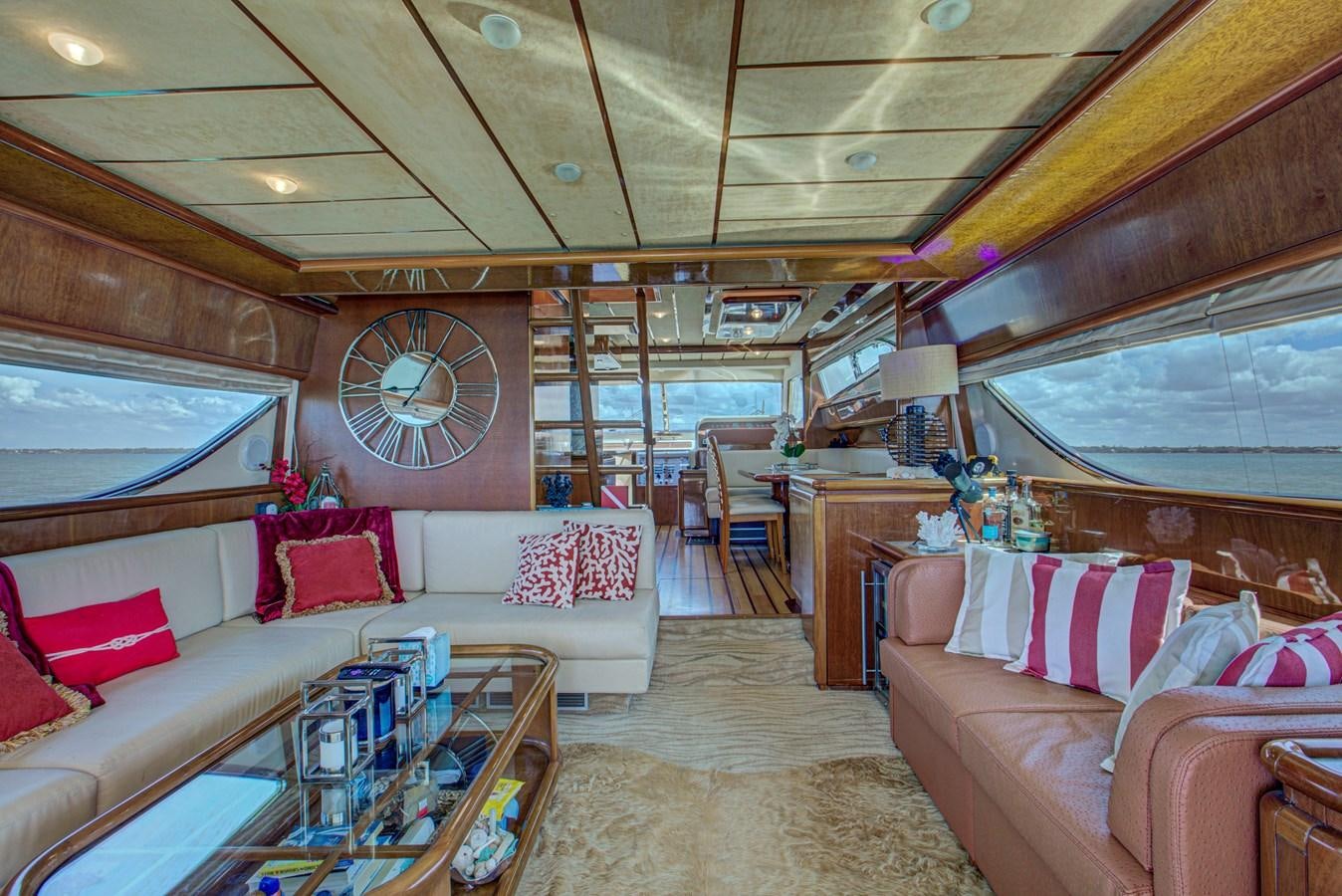 a living room with a large window aboard FERRETTI Yacht for Sale