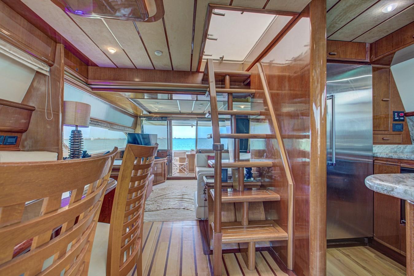 a wood cabin with wood floors aboard FERRETTI Yacht for Sale