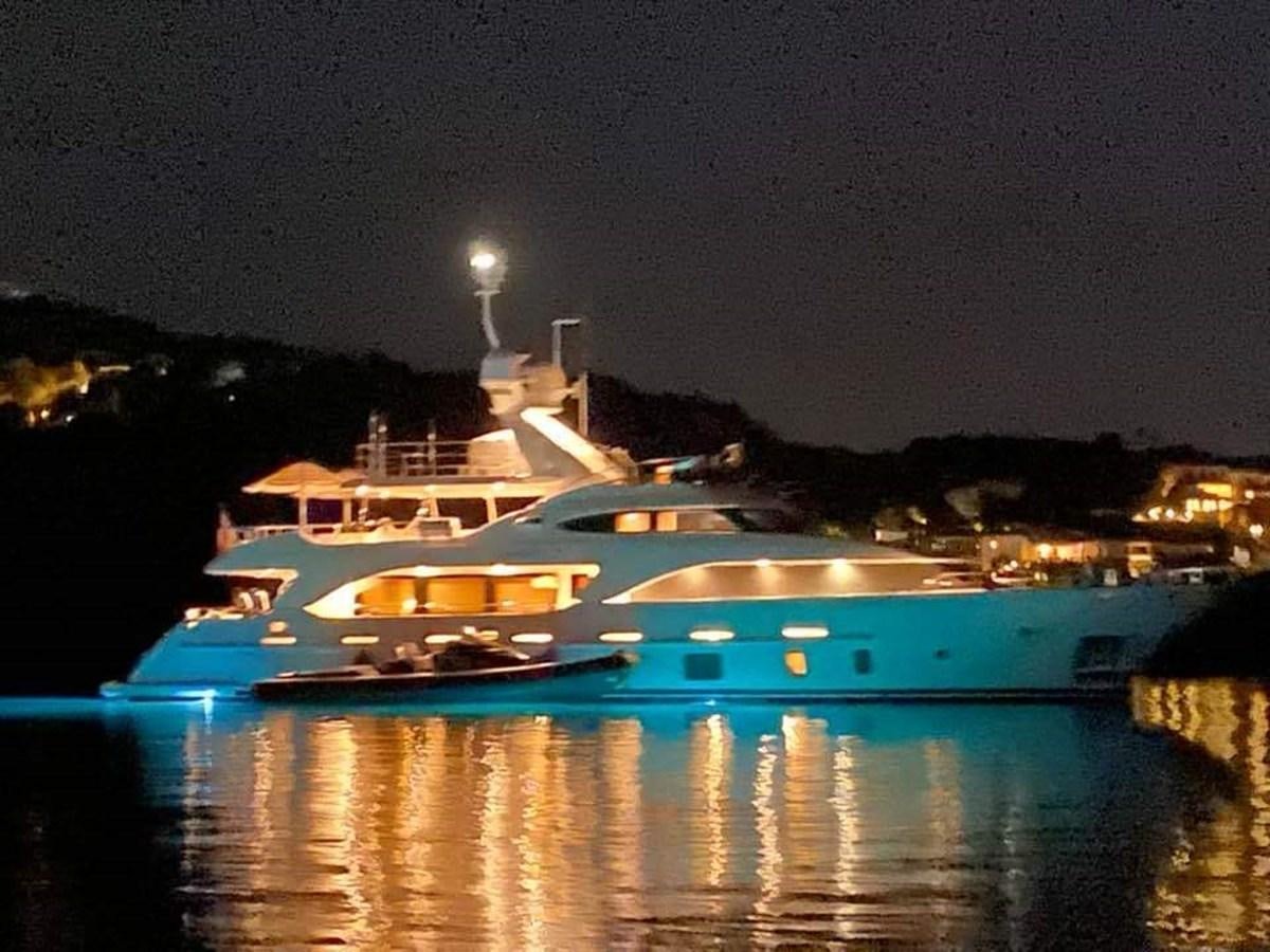 a large cruise ship at night aboard BENNETTI 105 Yacht for Sale