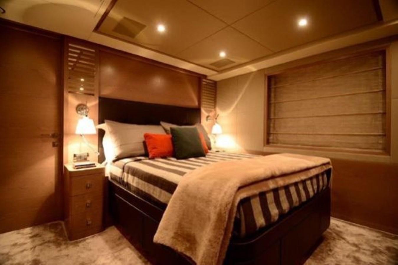 a bed with pillows and pillows aboard BENNETTI 105 Yacht for Sale