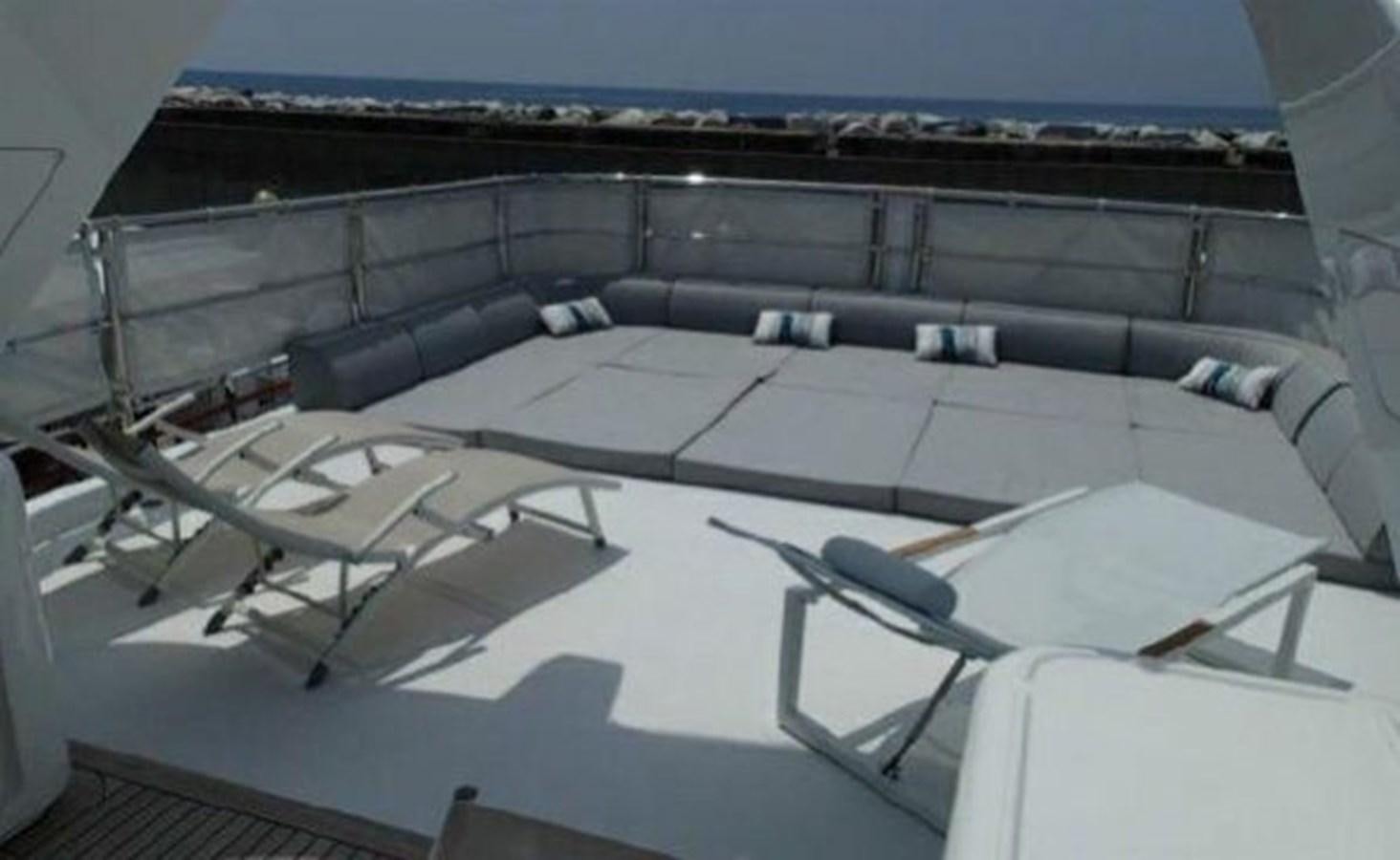 a large room with a large balcony aboard BENNETTI 105 Yacht for Sale