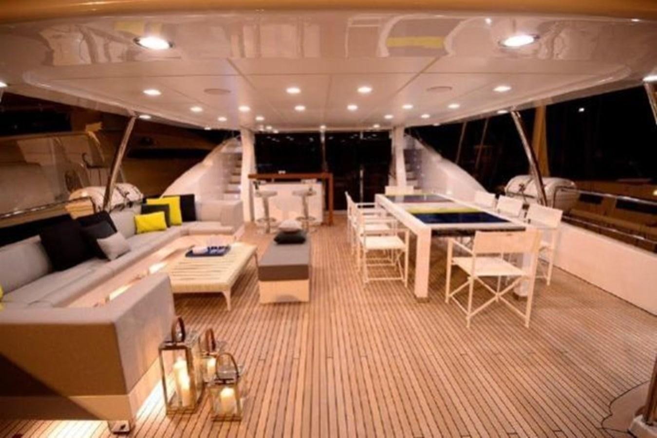 a room with tables and chairs aboard BENNETTI 105 Yacht for Sale