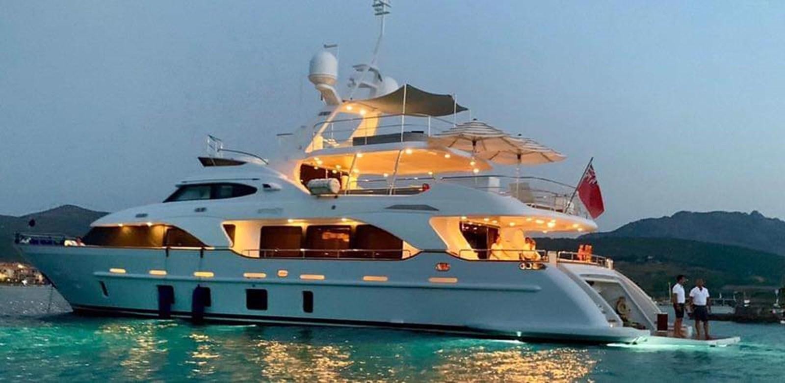 a large white boat with a flag on it aboard BENNETTI 105 Yacht for Sale
