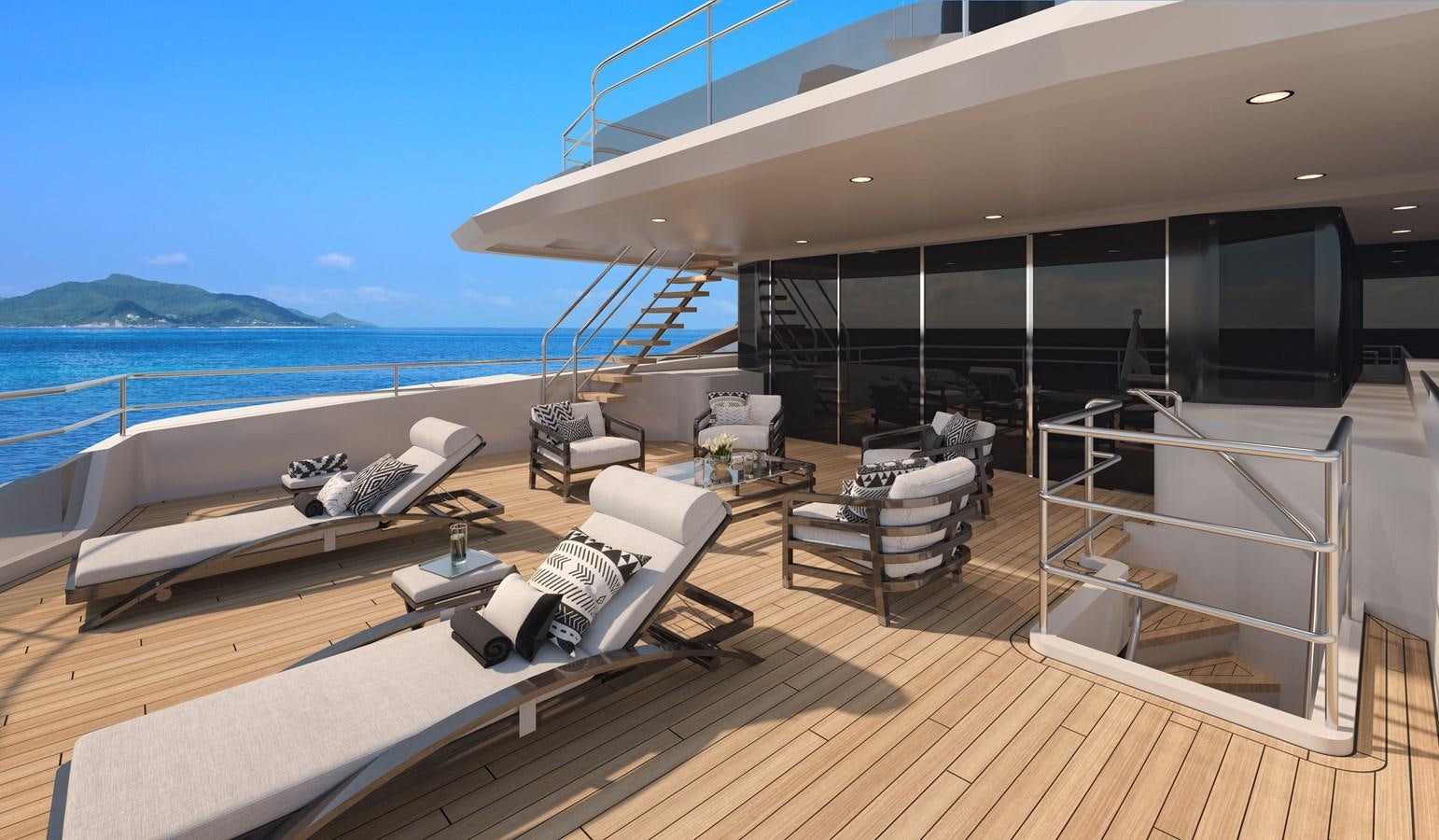 a deck with a large pool and deck chairs aboard MOONEN MARQUIS Yacht for Sale