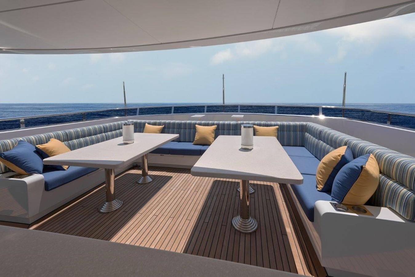 a room with a table and a couch aboard EP150 Yacht for Sale