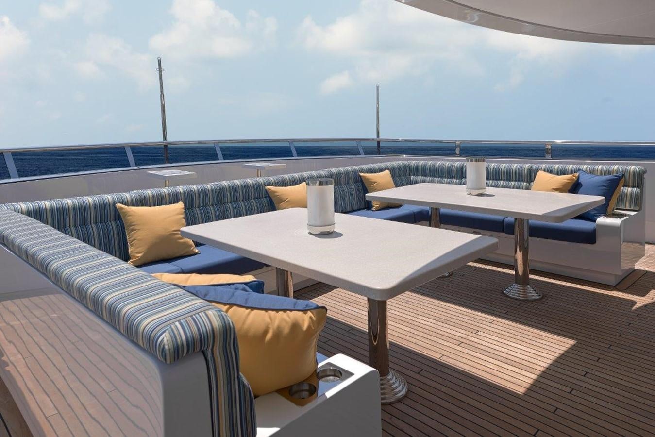 a room with a table and chairs aboard EP150 Yacht for Sale