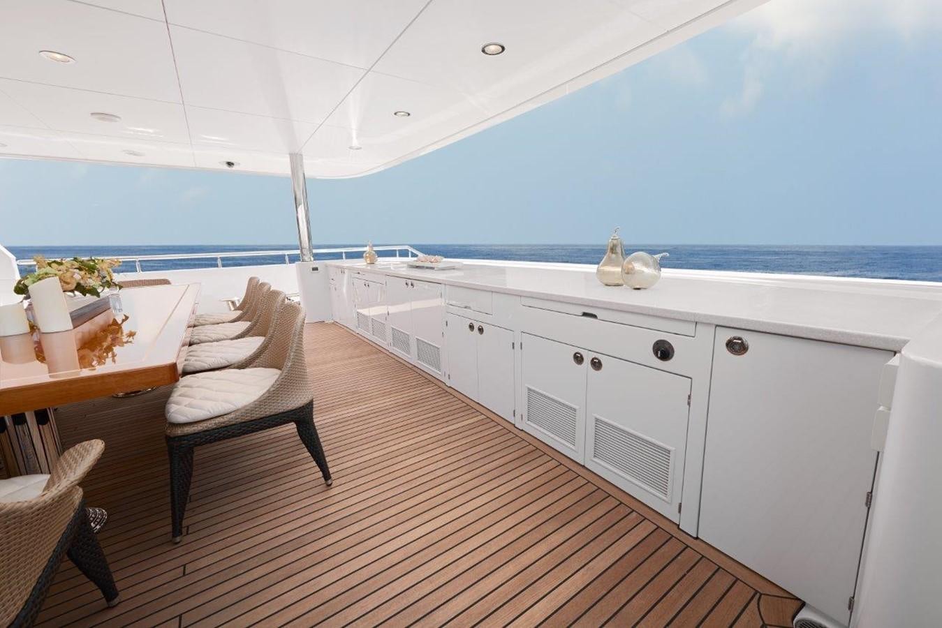 a white kitchen with a large window aboard EP150 Yacht for Sale