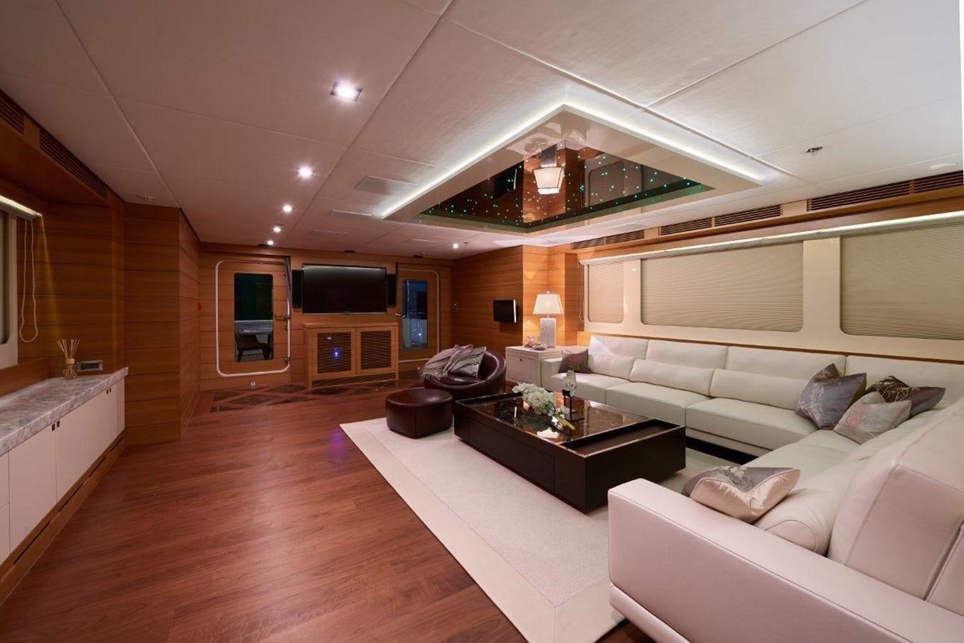 a living room with a large bed aboard EP150 Yacht for Sale