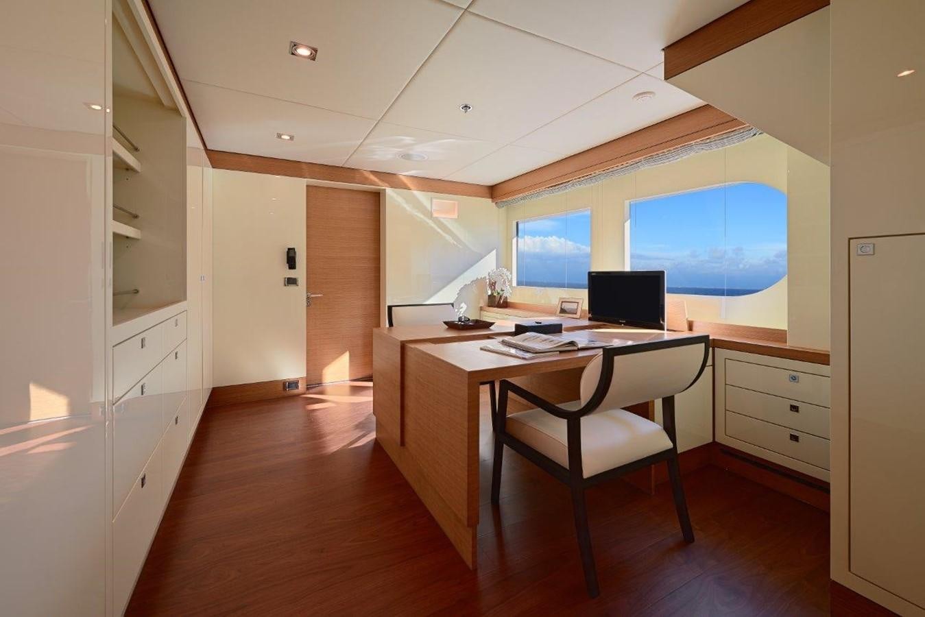 a room with a desk and a laptop aboard EP150 Yacht for Sale