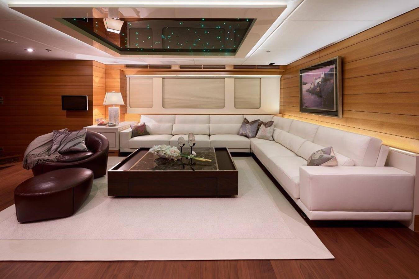 a living room with a couch and a coffee table aboard EP150 Yacht for Sale